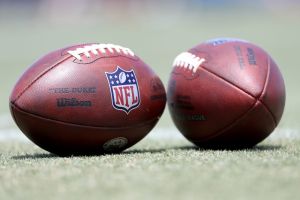 Jul 30, 2022; Irvine, CA, USA; A general view of the official NFL balls on the field during Los Angeles Rams training camp at University of California Irvine.