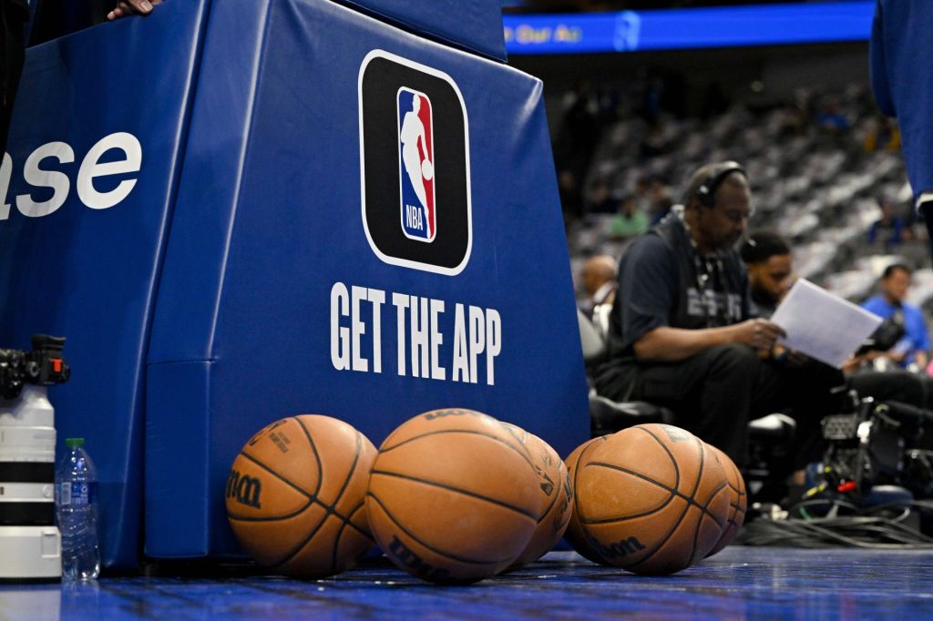 Mar 5, 2023; Dallas, Texas, USA; A view of the NBA logo and NBA app logo and basketballs in front of the base during warms up before the game between the Dallas Mavericks and the Suns at the American Airlines Center.