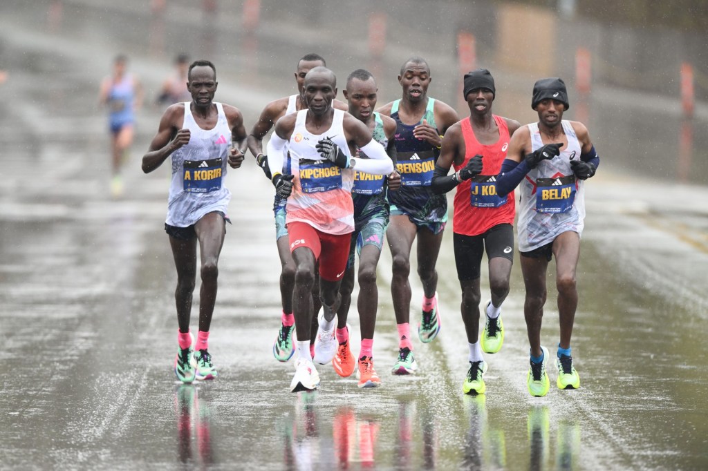 Apr 17, 2023; Boston, MA, USA; Eliud Kipchoge of Kenya and Andualem Belay of Ethiopia lead the menÕs elite pack during the 2023 Boston Marathon. Mandatory Credit: