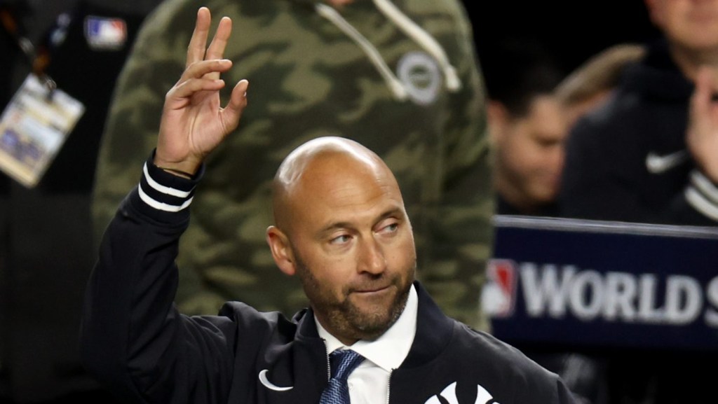 Oct 28, 2024; New York, New York, USA; MLB Hall of Fame player and former New York Yankee captain Derek Jeter throws out a ceremonial first pitch before game three of the 2024 MLB World Series between the Los Angeles Dodgers and Yankees at Yankee Stadium