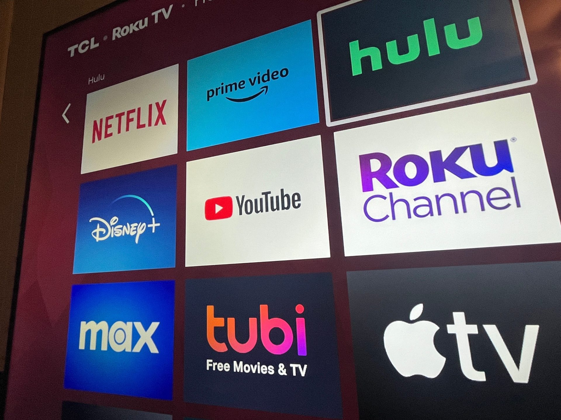 YouTube/ Multiple streaming services appear on a Roku TV.