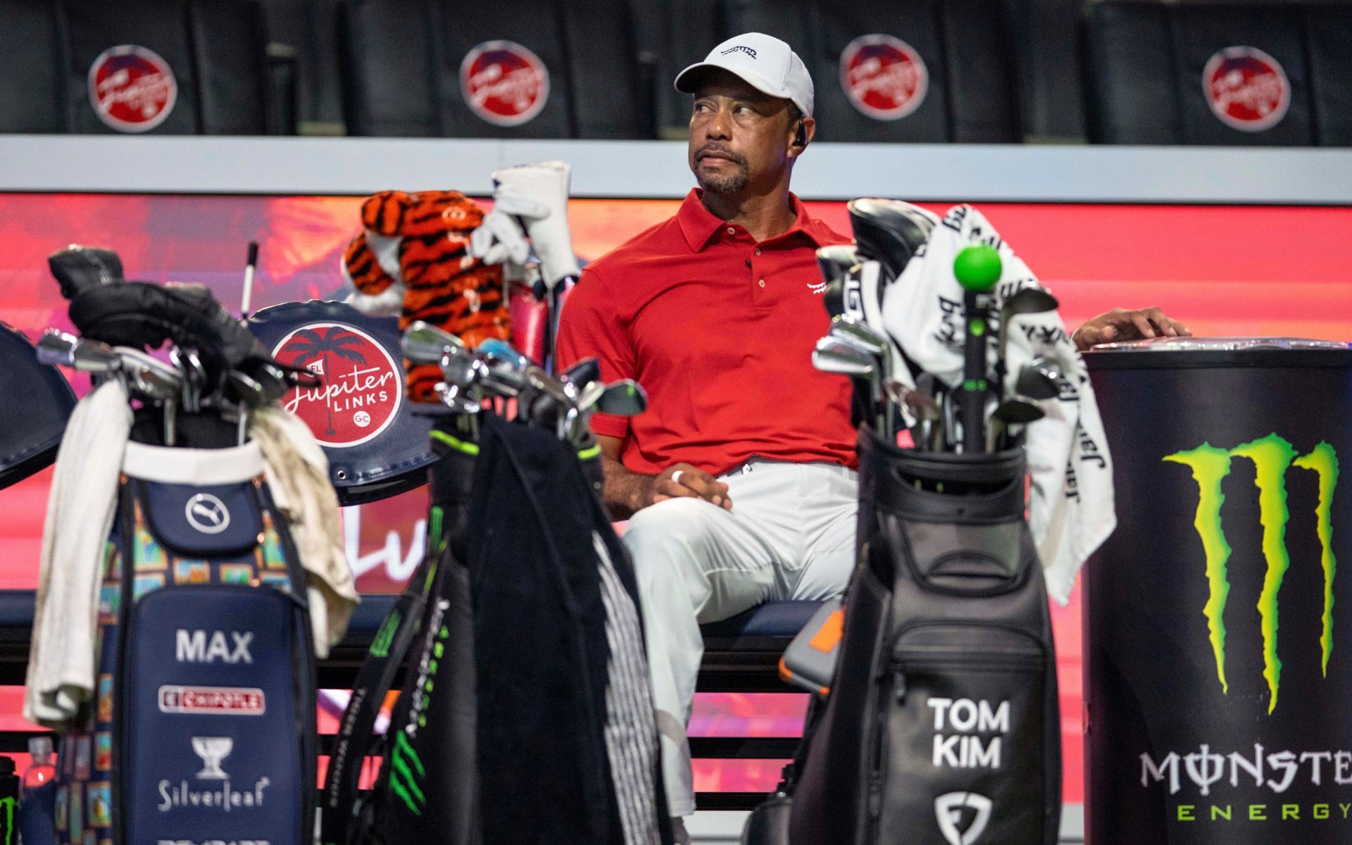 Tiger Woods of Jupiter Links GC sits during a break in their TGL golf match against Atlanta Drive GC at SoFi Center on March 4, 2025, in Palm Beach Gardens, Florida.