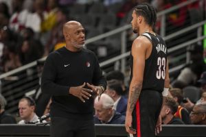 Apr 1, 2025; Atlanta, Georgia, USA; Portland Trail Blazers head coach Chauncey Billups talks to forward Toumani Camara (33) during the game against the Atlanta Hawks during the second half at State Farm Arena.