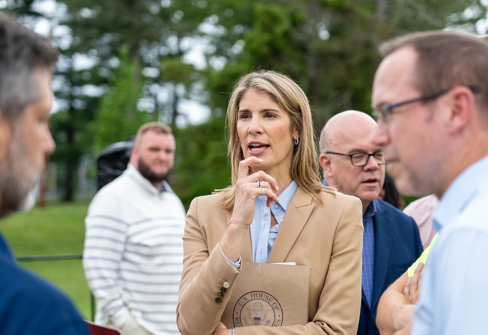 Congresswoman Lori Trahan talks with people outside the Shriver Job Corps Center in Devens June 18