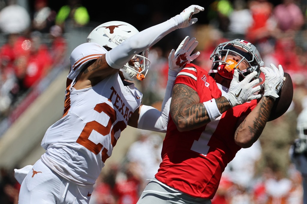 Aug 30, 2025; Columbus, Ohio, USA; Ohio State Buckeyes wide receiver Brandon Inniss (1) attempts to make a catch over Texas Longhorns defensive back Graceson Littleton (29) in the first half at Ohio Stadium.