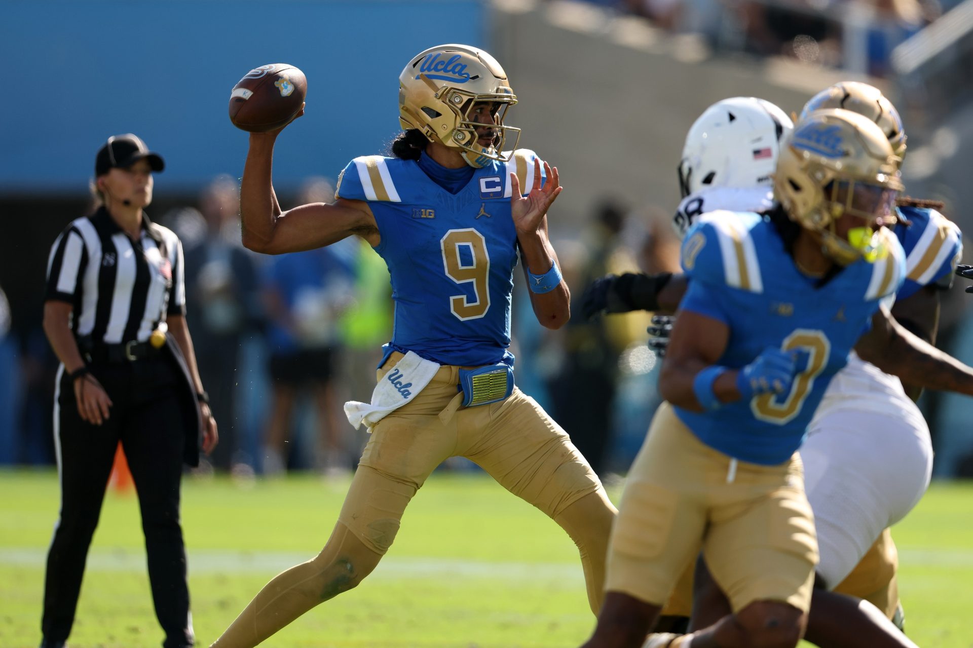 Oct 4, 2025; Pasadena, California, USA; UCLA Bruins quarterback Nico Iamaleava (9) passes the ball during the fourth quarter against the Penn State Nittany Lions at Rose Bowl.