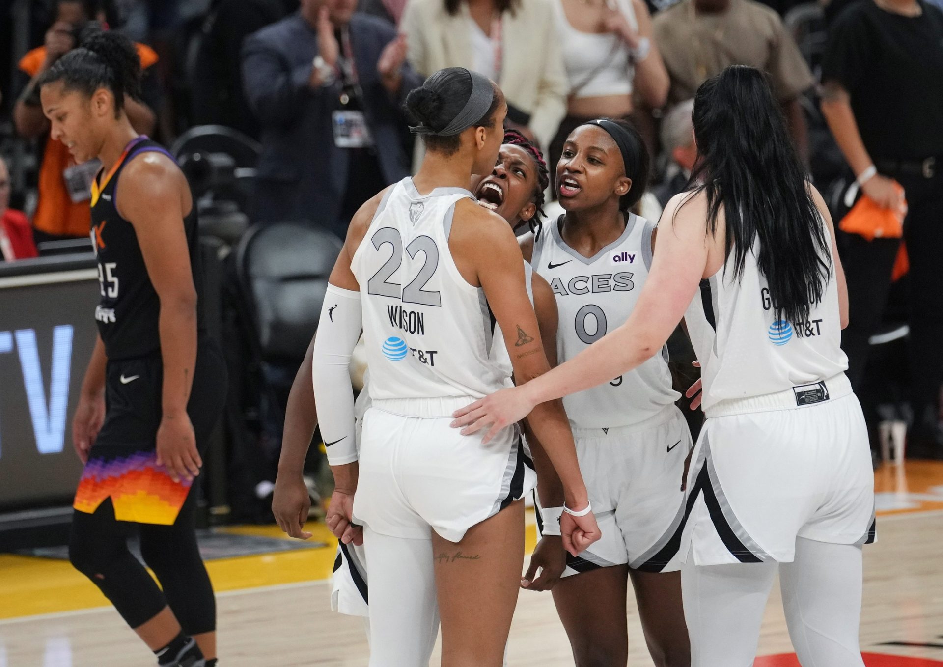 Las Vegas Aces center A'ja Wilson (22) celebrates with her teammates after her last second shot to take the lead 90-88 against the Phoenix Mercury in Game 3 of the WNBA Finals at Mortgage Matchup Center in Phoenix on Oct. 8, 2025.