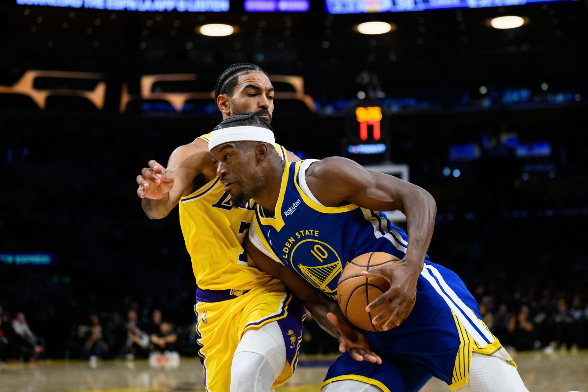 Oct 21, 2025; Los Angeles, California, USA; Golden State Warriors forward Jimmy Butler III (10) drives against Los Angeles Lakers guard Gabe Vincent (7) during the second half at Crypto.com Arena.