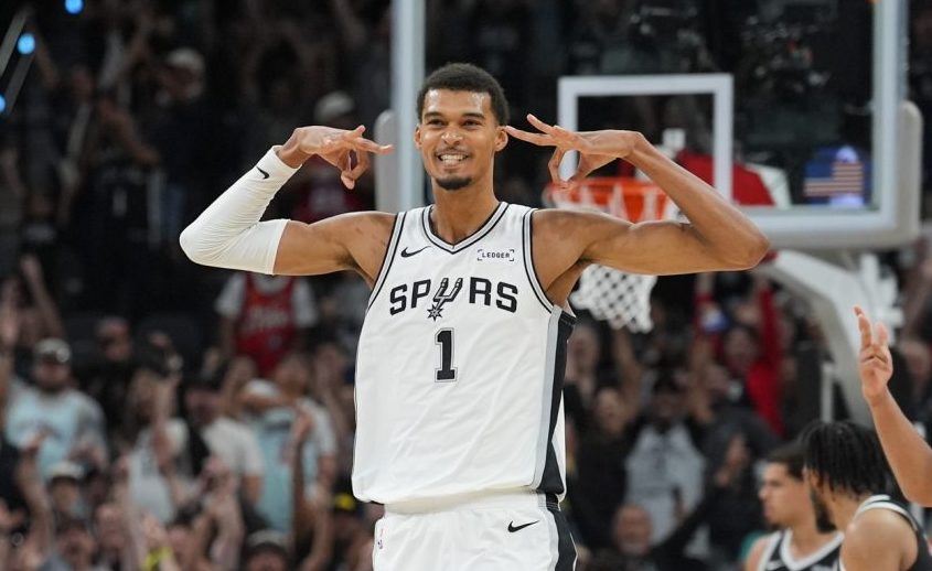 Oct 26, 2025; San Antonio, Texas, USA; San Antonio Spurs forward Victor Wembanyama (1) celebrates a three-point shot in the second half against the Brooklyn Nets at Frost Bank Center.