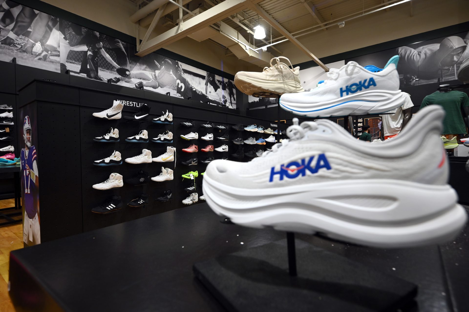 Hoka Sneakers of various brands on display at a Dick's Sporting Goods retail store, New York, NY, August 4, 2025. China, Vietnam and Indonesia are the top countries where shoes are manufactured and tariffs of a minimum of 19% for these three countries goes into effect next week.