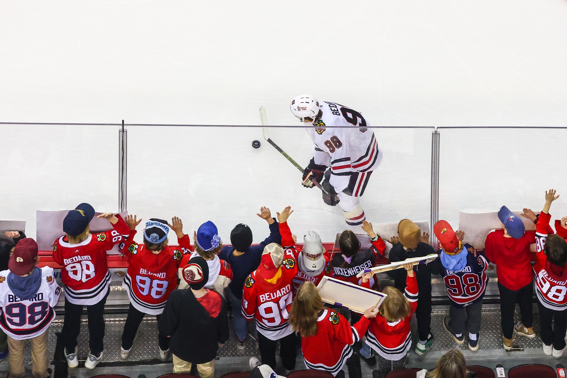 Dec 21, 2024; Calgary, Alberta, CAN; Chicago Blackhawks center Connor Bedard (98) skates with the puck in front of his fans during the warmup period against the Calgary Flames at Scotiabank Saddledome.