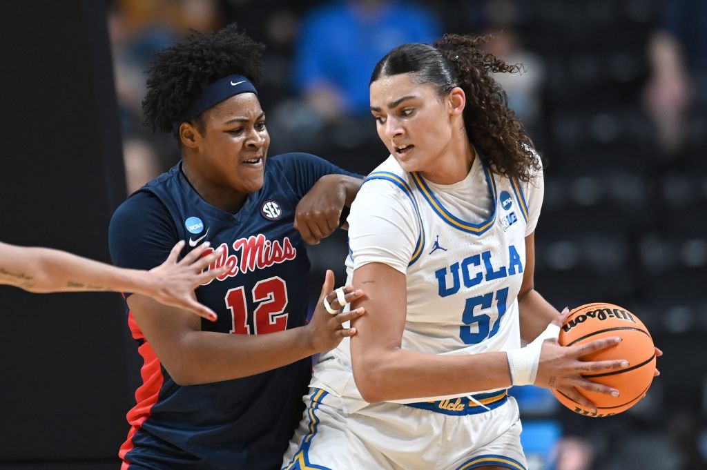Mar 28, 2025; Spokane, WA, USA; UCLA Bruins center Lauren Betts (51) fights for position against Ole Miss Rebels forward Christeen Iwuala (12). during the first half of a Sweet 16 NCAA Tournament basketball game at Spokane Arena. at Spokane Arena.