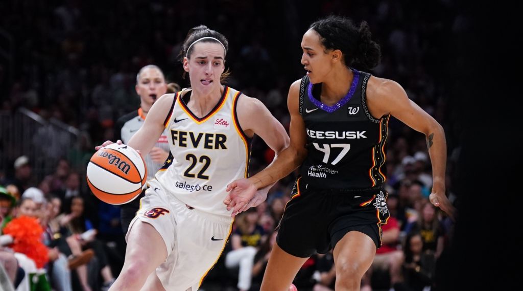 Jul 15, 2025; Boston, Massachusetts, USA; Indiana Fever guard Caitlin Clark (22) drives the ball against Connecticut Sun guard Leila Lacan (47) in the second quarter at TD Garden. Mandatory Credit: