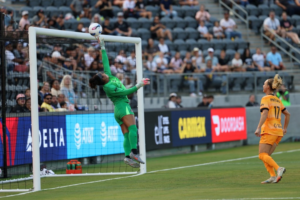Oct 12, 2025; Los Angeles, California, USA;  Houston Dash goalkeeper Abby Smith (35) makes a save during the first half against Angel City FC at BMO Stadium