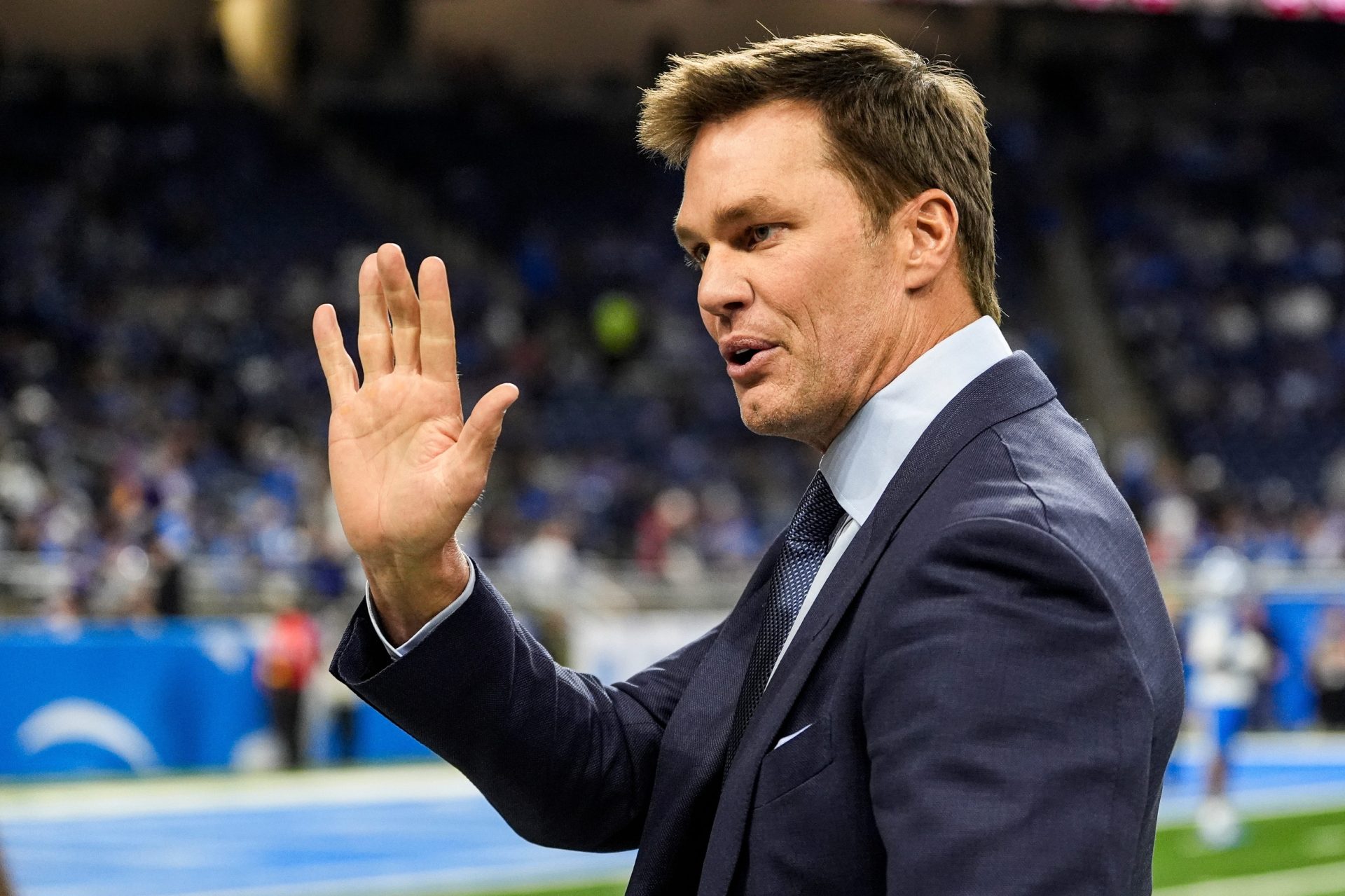 Tom Brady waves at Detroit Lions fans at Ford Field in Detroit on Sunday, November 2, 2025.