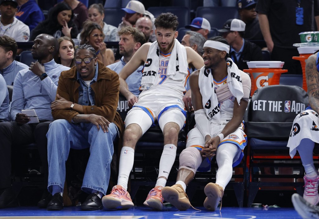 Nov 12, 2025; Oklahoma City, Oklahoma, USA; Oklahoma City Thunder guard Jalen Williams (8), center Chet Holmgren (7), and guard Shai Gilgeous-Alexander (2) talk while sitting on the bench during the fourth quarter against the Los Angeles Lakers at Paycom Center.