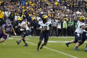 Nov 15, 2025; Chicago, Illinois, USA; Michigan Wolverines quarterback Bryce Underwood (19) throws the ball against the Northwestern Wildcats during the first half at Wrigley Field.
