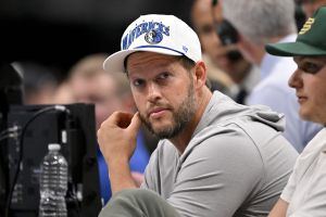 Nov 19, 2025; Dallas, Texas, USA; Los Angeles Dodgers pitcher Clayton Kershaw looks on during the second quarter between the Dallas Mavericks and the New York Knicks at the American Airlines Center.