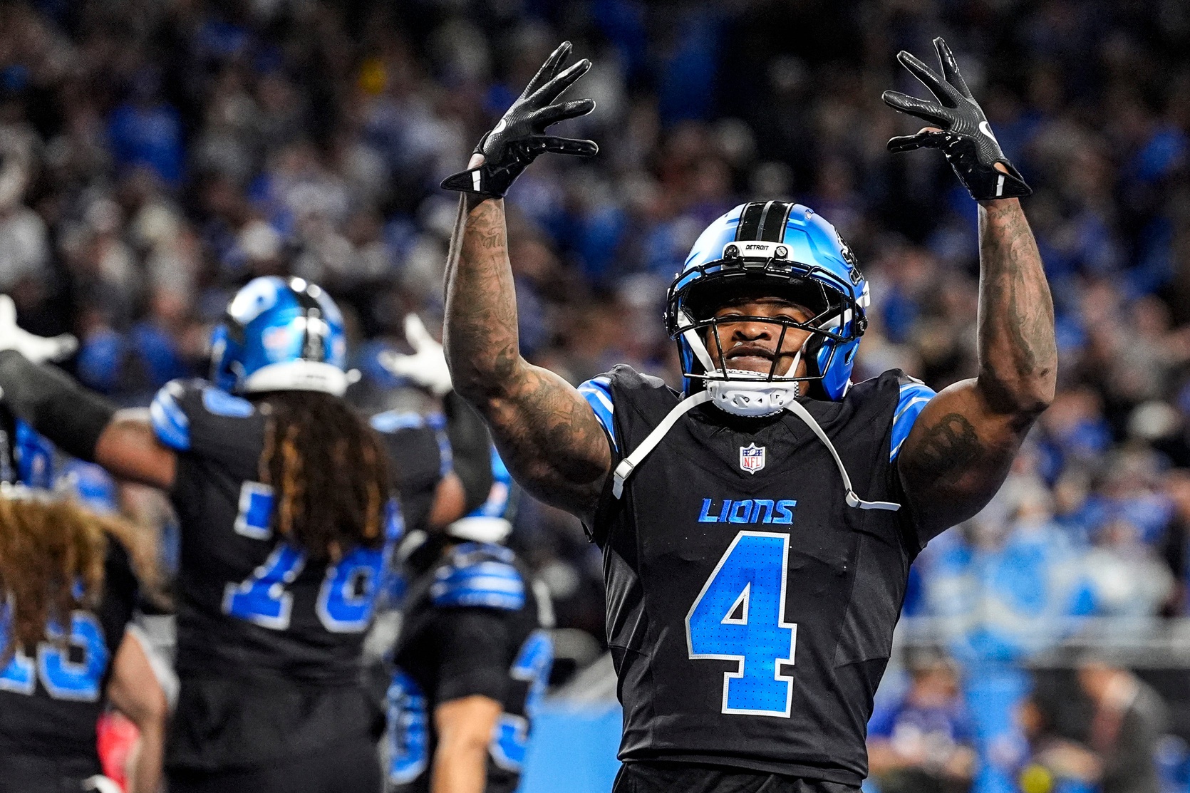 Detroit Lions cornerback D.J. Reed (4) celebrates 34-27 win over New York Giants in overtime at Ford Field in Detroit on Sunday, Nov. 23, 2025.