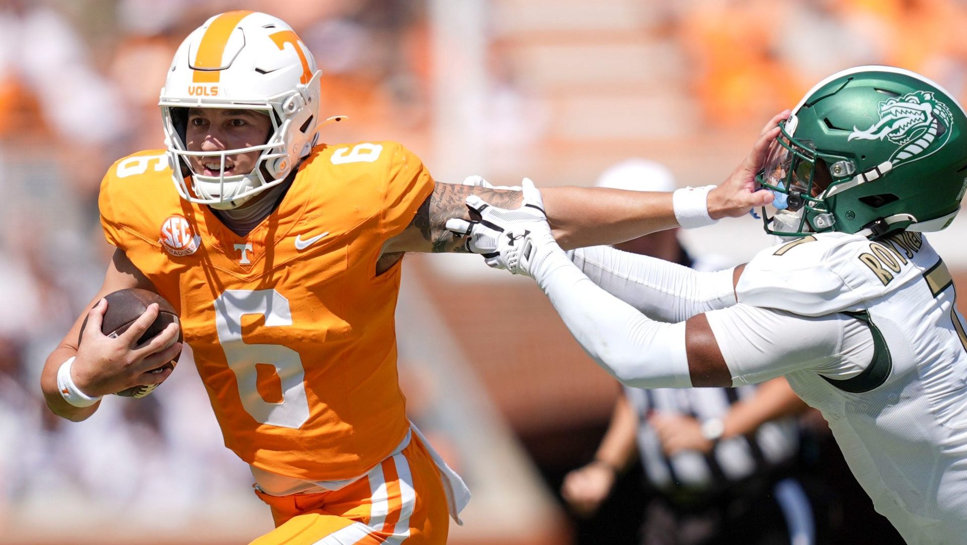Tennessee quarterback Joey Aguilar (6) holds off UAB safety Pierre Royster (7) during an NCAA college football game on September 20, 2025, in Knoxville, Tennessee