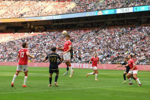 Jul 27, 2024; Vancouver, British Columbia, CAN; Wrexham AFC defender Max Cleworth (4) goes up for a header against Vancouver Whitecaps FC during the second half at BC Place.