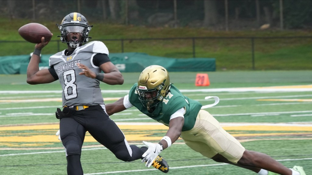Montvale, NJ -- August 31, 2024 -- Quarterback Siren Edwards of St. Frances is chased by Thai Gray of St. Jospeh in the first half. St. Frances Academy of Baltimore defeated St. Joseph Regional 31-21 in a game played in Montvale.
