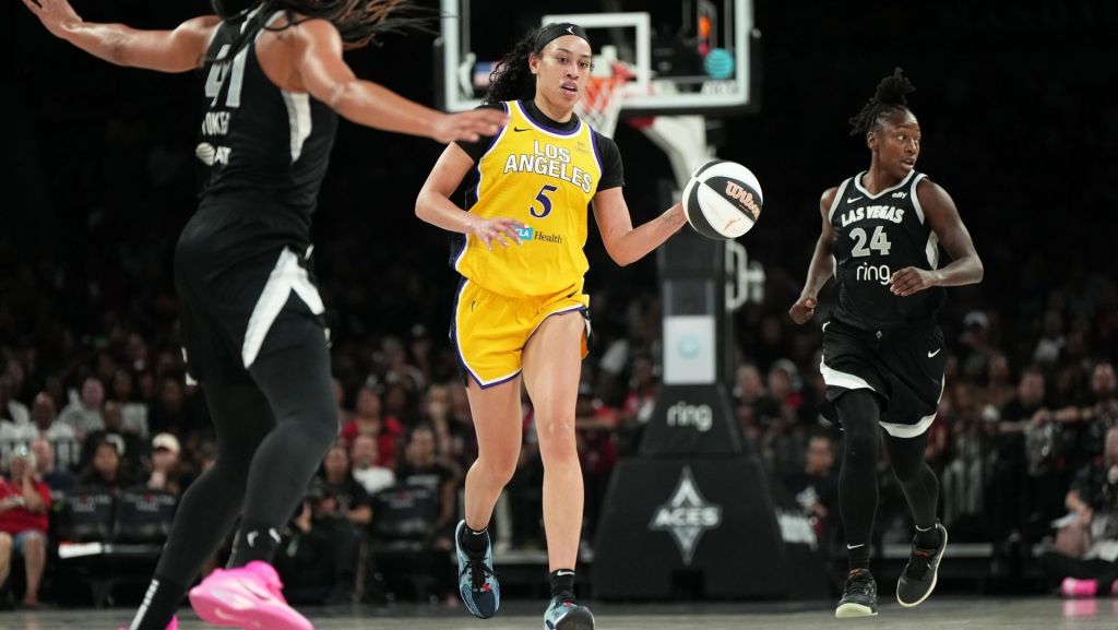 Jun 11, 2025; Las Vegas, Nevada, USA; Los Angeles Sparks forward Dearica Hamby (5) dribbles the ball against Las Vegas Aces center Kiah Stokes (41) during the second half of a WNBA basketball game at Michelob Ultra Arena.