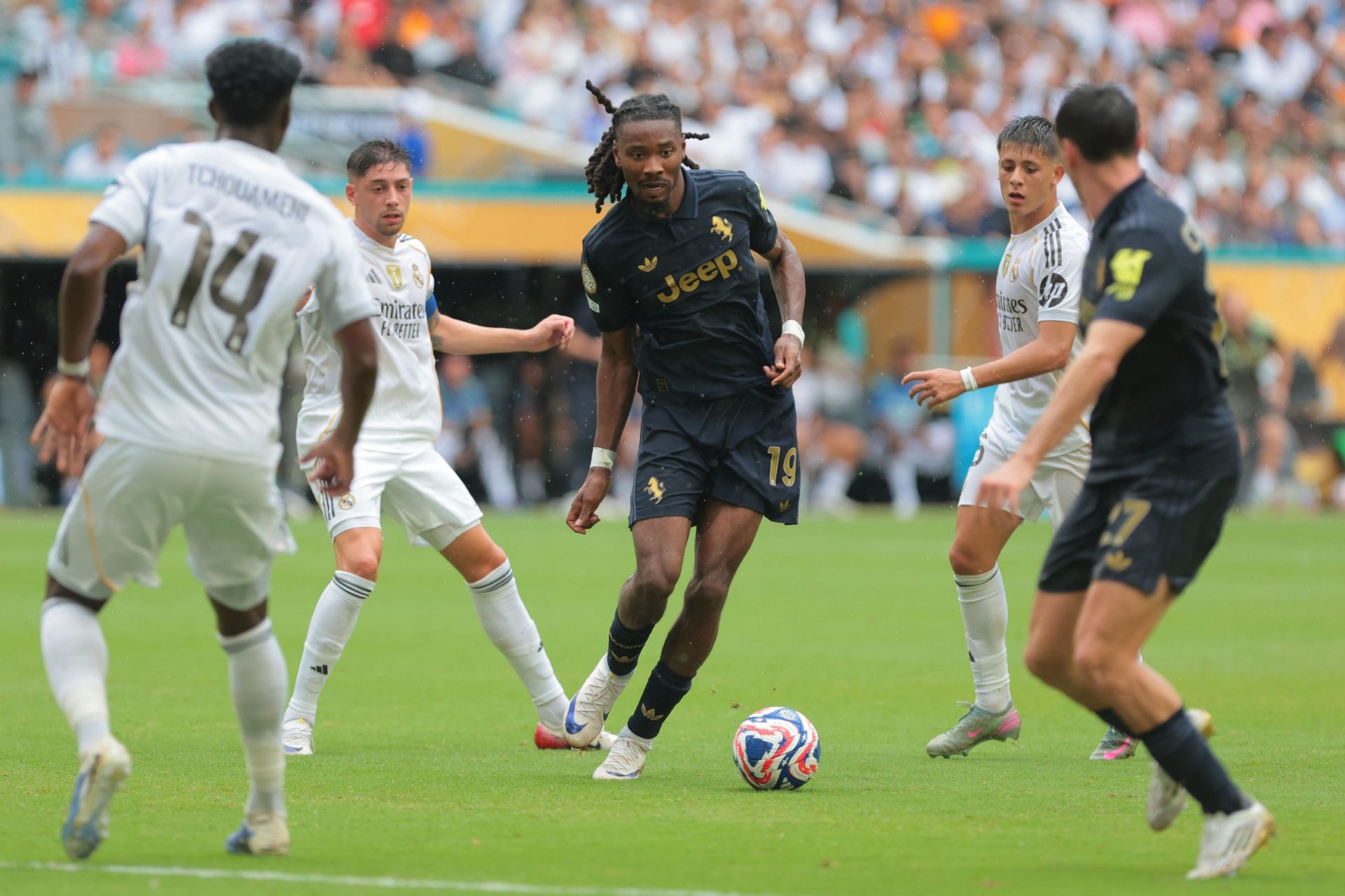 Jul 1, 2025; Miami Gardens, Florida, USA; Juventus FC midfielder Khephren Thuram (19) kicks the ball against Real Madrid C.F. during a round of 16 match of the 2025 FIFA Club World Cup at Hard Rock Stadium.