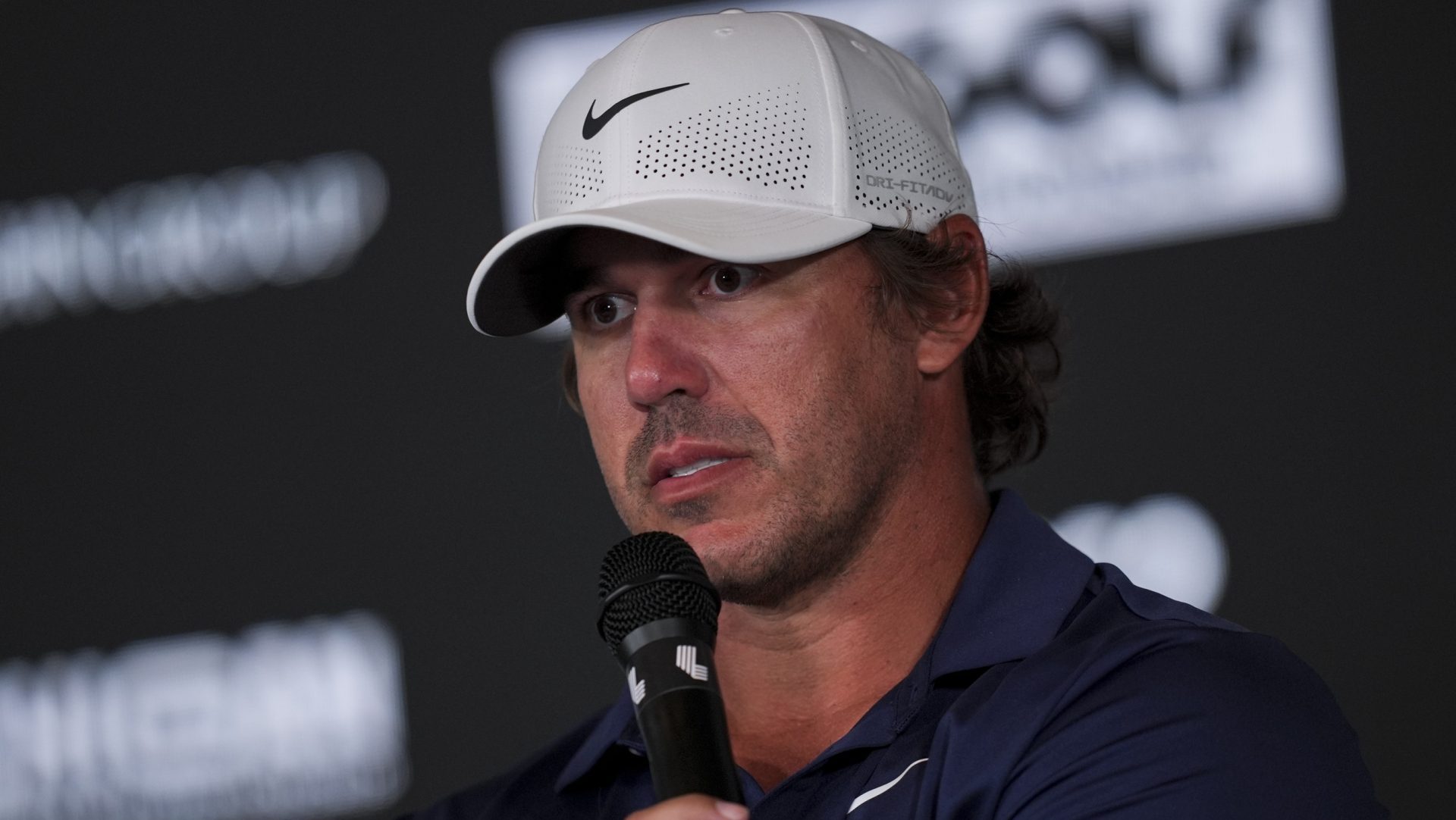 Aug 22, 2025; Detroit, Michigan, USA; Brooks Koepka of Smash GC address the media after the quarterfinals of the LIV Golf Michigan Team Championship at The Cardinal at Saint John's Resort.