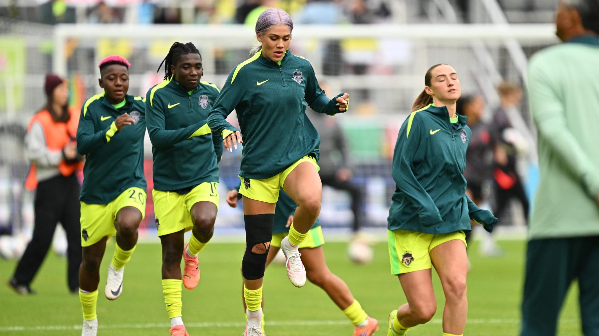 Nov 15, 2025; Washington, District of Columbia, USA; Washington Spirit forward Trinity Rodman (2), middle, warms up before a match against the Portland Thorns at Audi Field.