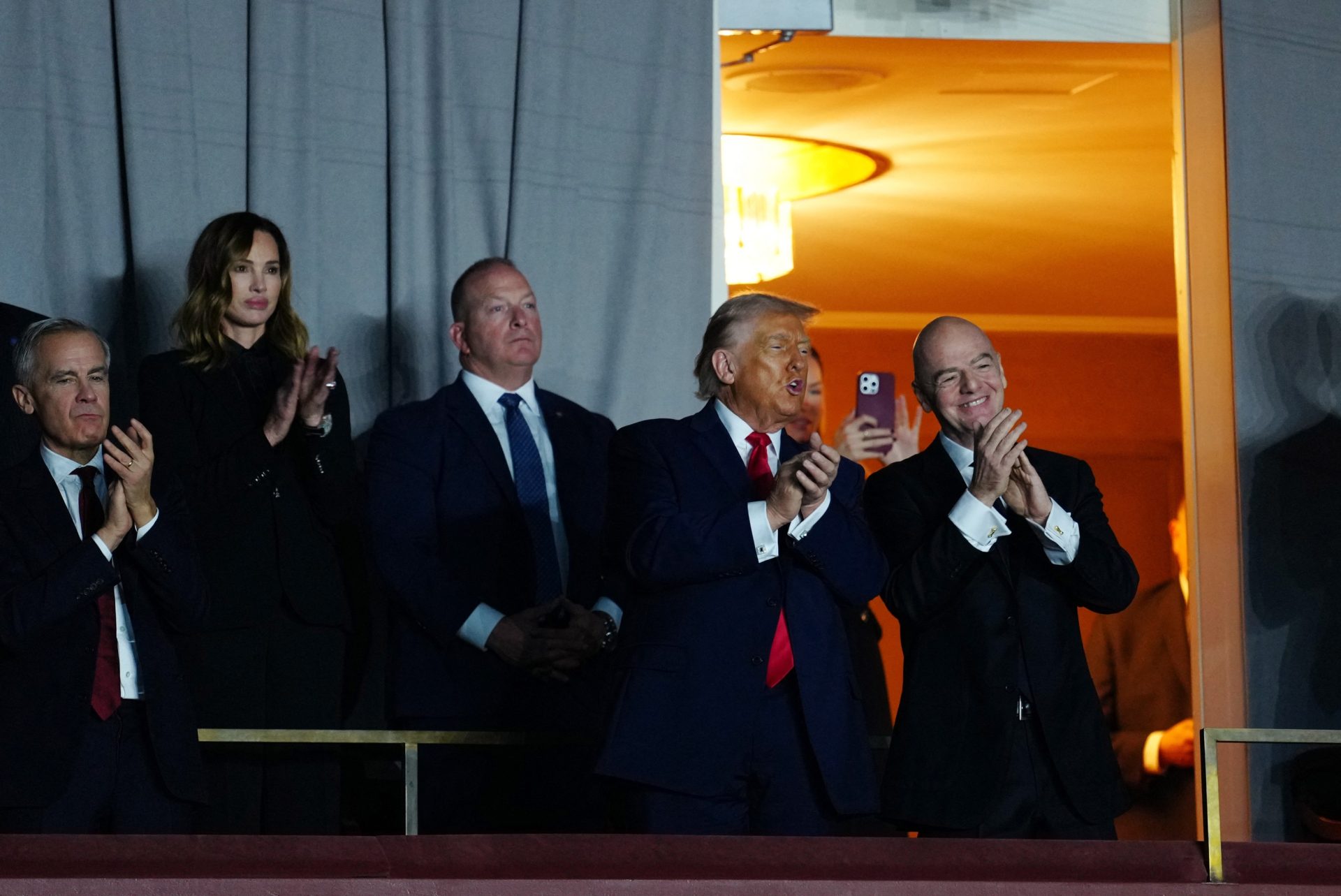 [US, Mexico & Canada customers only] Dec 5, 2025; Washington, District of Columbia, USA; United States of America President Donald Trump, FIFA President Gianni Infantino and Canada Prime Minister Mark Carney watch from the stands during the FIFA World Cup 2026 Final Draw at John F. Kennedy Center for the Performing Arts.