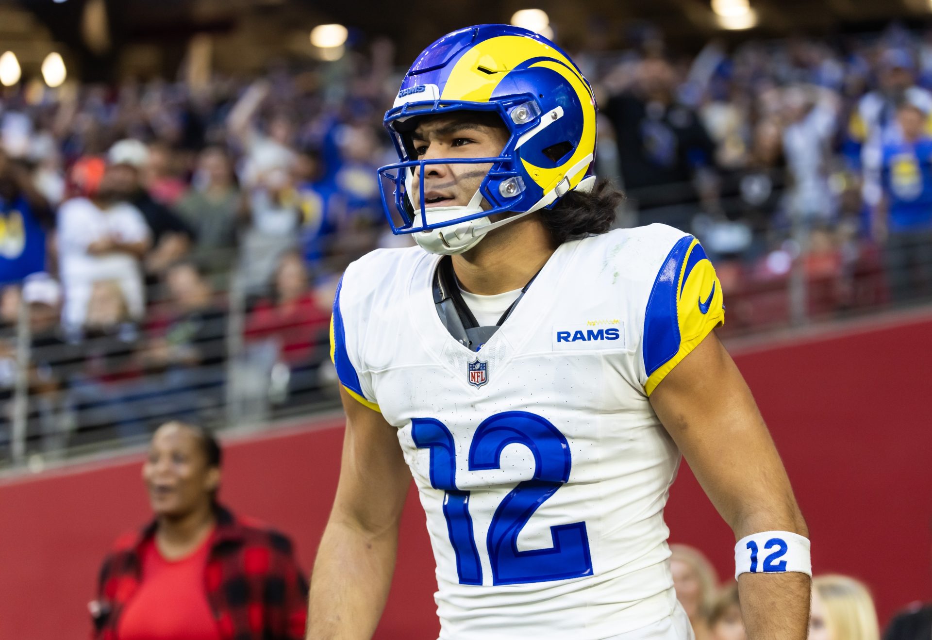 Dec 7, 2025; Glendale, Arizona, USA; Los Angeles Rams wide receiver Puka Nacua (12) reacts after scoring a touchdown against the Arizona Cardinals at State Farm Stadium.