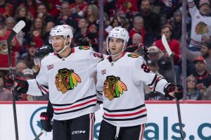 Dec 20, 2025; Ottawa, Ontario, CAN; Chicago Blackhawks left wing Andre Burakovsky (28) celebrates with center Ryan Greene (20) his goal scored in the second period against the Ottawa Senators at the Canadian Tire Centre.