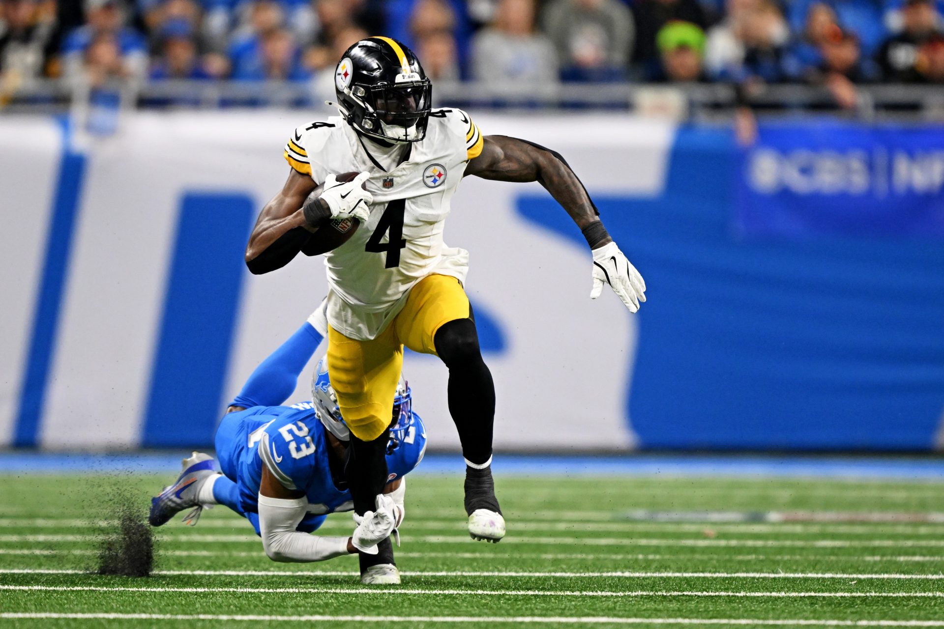 Dec 21, 2025; Detroit, Michigan, USA; Detroit Lions cornerback Rock Ya-Sin (23) tackles Pittsburgh Steelers wide receiver DK Metcalf (4) during the fourth quarter at Ford Field.