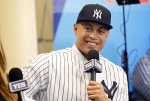 Dec 11, 2017; Orlando, FL, USA; New York Yankees outfielder Giancarlo Stanton (27) talks with Yes Network during the winter meetings at Walt Disney World Swan and Dolphin Resort.