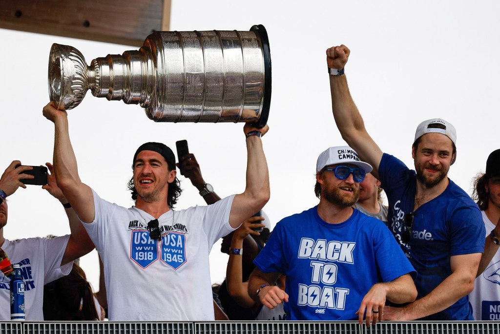 Jul 12, 2021; Tampa, FL, USA; Tampa Bay Lightning defenseman Ryan McDonagh (27) hoists the Stanley Cup during the Stanley Cup Championship parade.