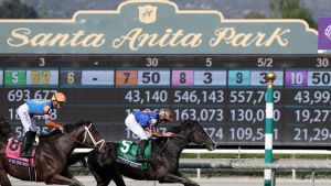 Nov 4, 2023; Santa Anita, CA, USA; Auguste Rodin (5), with jockey Ryan Moore up, wins the BREEDERS CUP TURF during the 2023 Breeders Cup World Championships at Santa Anita Park.