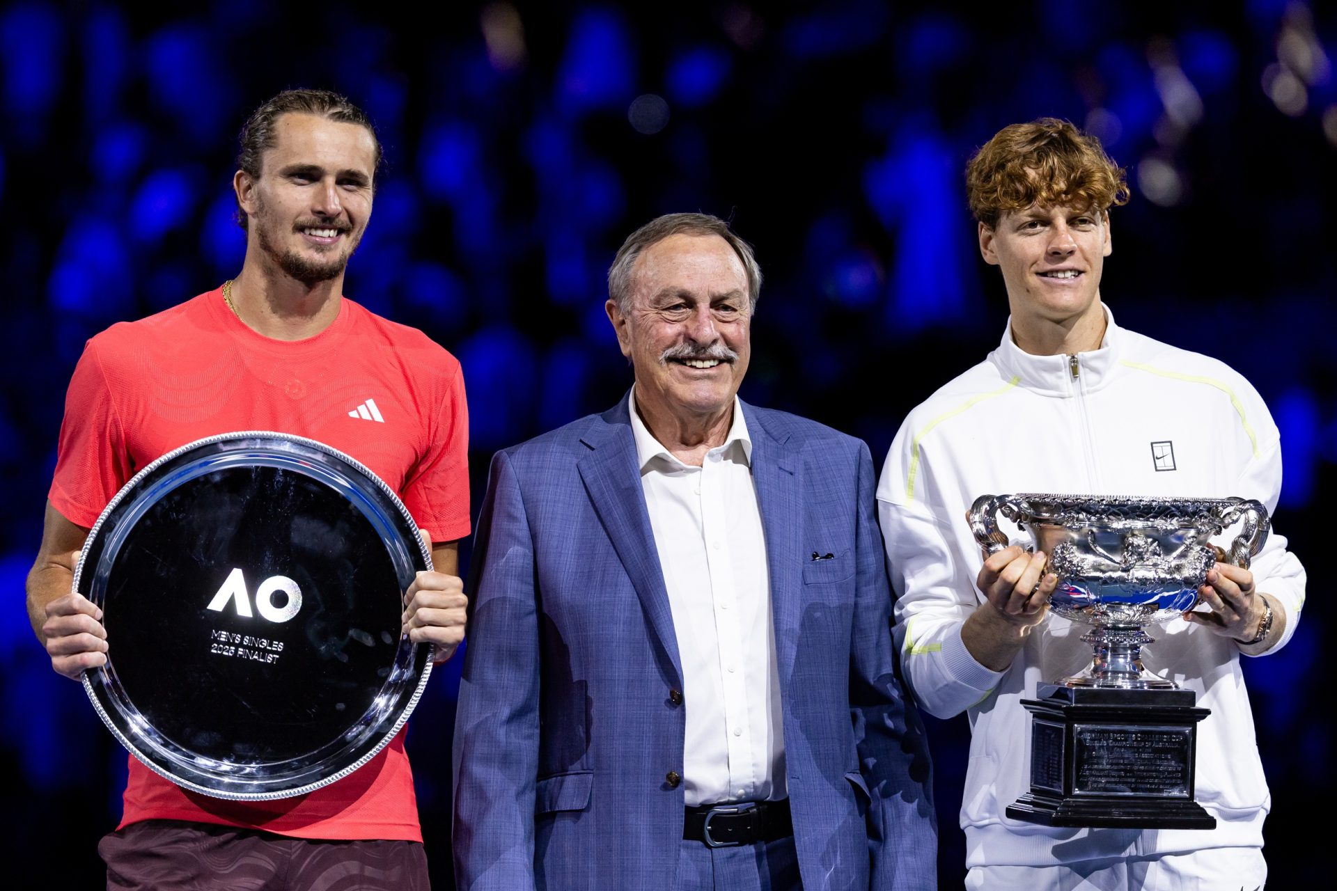 Jan 26, 2025; Melbourne, Victoria, Australia; Jannik Sinner of Italy and Alexander Zverev of Germany share a moment during the prize presentation of the men's single final at the 2025 Australian Open at Melbourne Park.