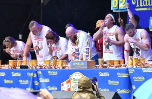 Contestants compete in the annual Nathan's hot dog eating contest at Tootsie's 57th Anniversary Birthday Bash on Lower Broadway in Nashville on Oct. 10, 2017.
