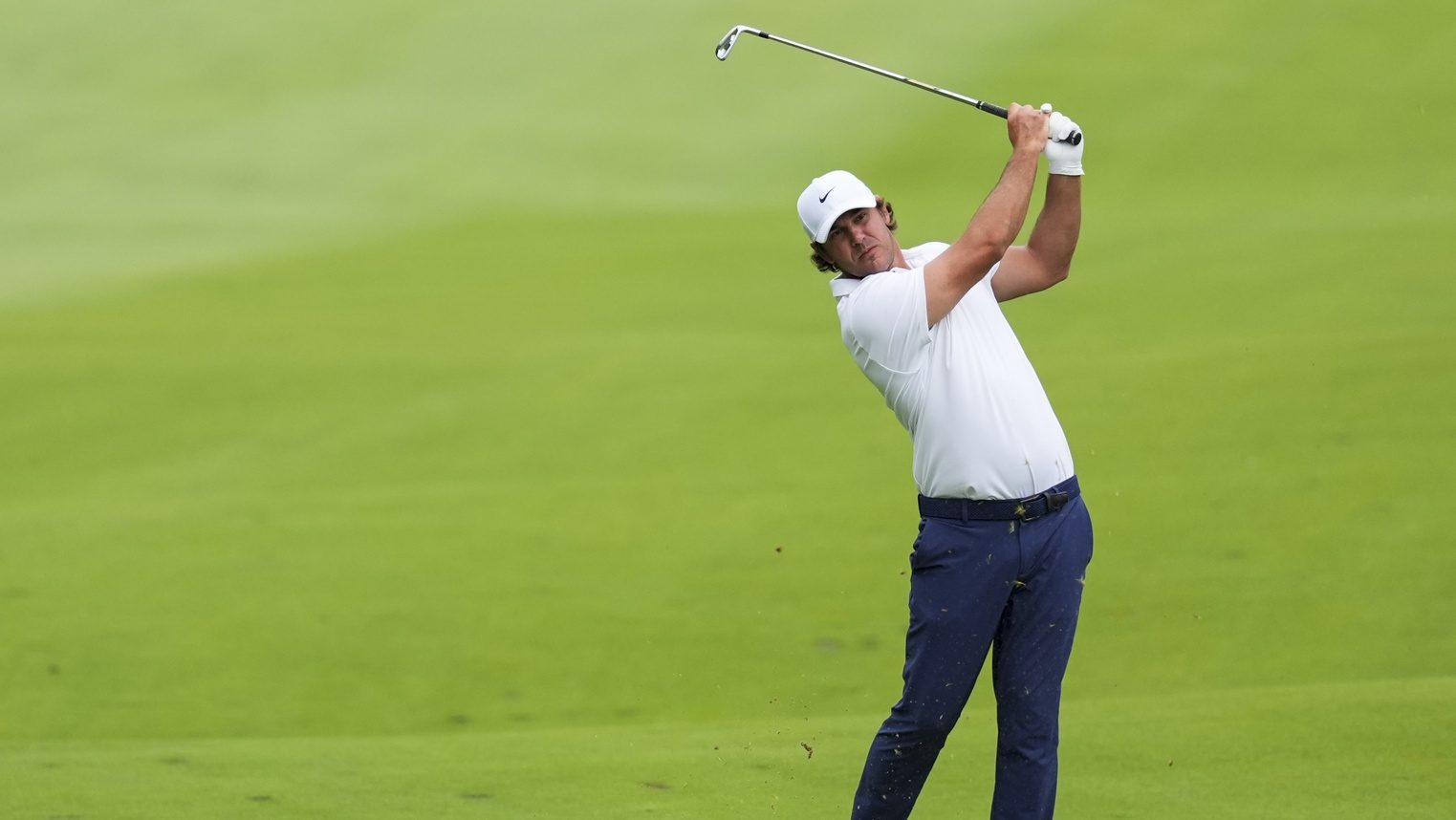 Aug 23, 2025; Detroit, Michigan, USA; Brooks Koepka of Smash GC plays his shot from the fairway on the sixth hole during the semifinals of the LIV Golf Michigan Team Championship at The Cardinal at Saint John's Resort.