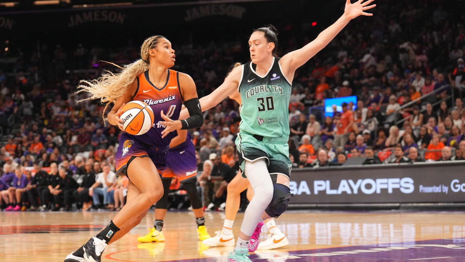 Sep 19, 2025; Phoenix, Arizona, USA; Phoenix Mercury forward Satou Sabally (0) dribbles against New York Liberty forward Breanna Stewart (30) during the second half of game three of round one for the 2025 WNBA Playoffs at PHX Arena.