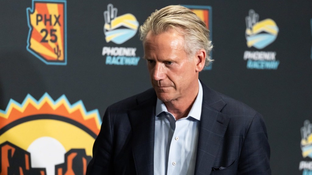 Oct 31, 2025; Avondale, Arizona, USA; NASCAR commissioner Steve Phelps walks off the stage following the state of the sport press conference in the media center at Phoenix Raceway.