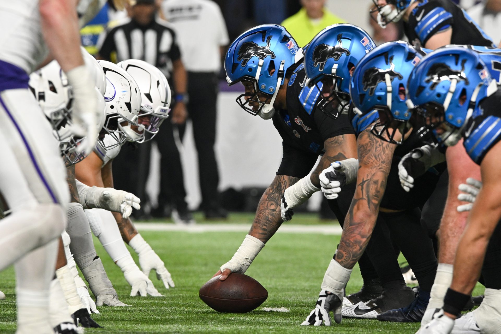 Dec 25, 2025; Minneapolis, Minnesota, USA; Detroit Lions center Graham Glasgow (60) waits to snap the ball against the Minnesota Vikings in the second quarter at U.S. Bank Stadium