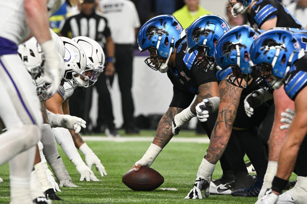Dec 25, 2025; Minneapolis, Minnesota, USA; Detroit Lions center Graham Glasgow (60) waits to snap the ball against the Minnesota Vikings in the second quarter at U.S. Bank Stadium