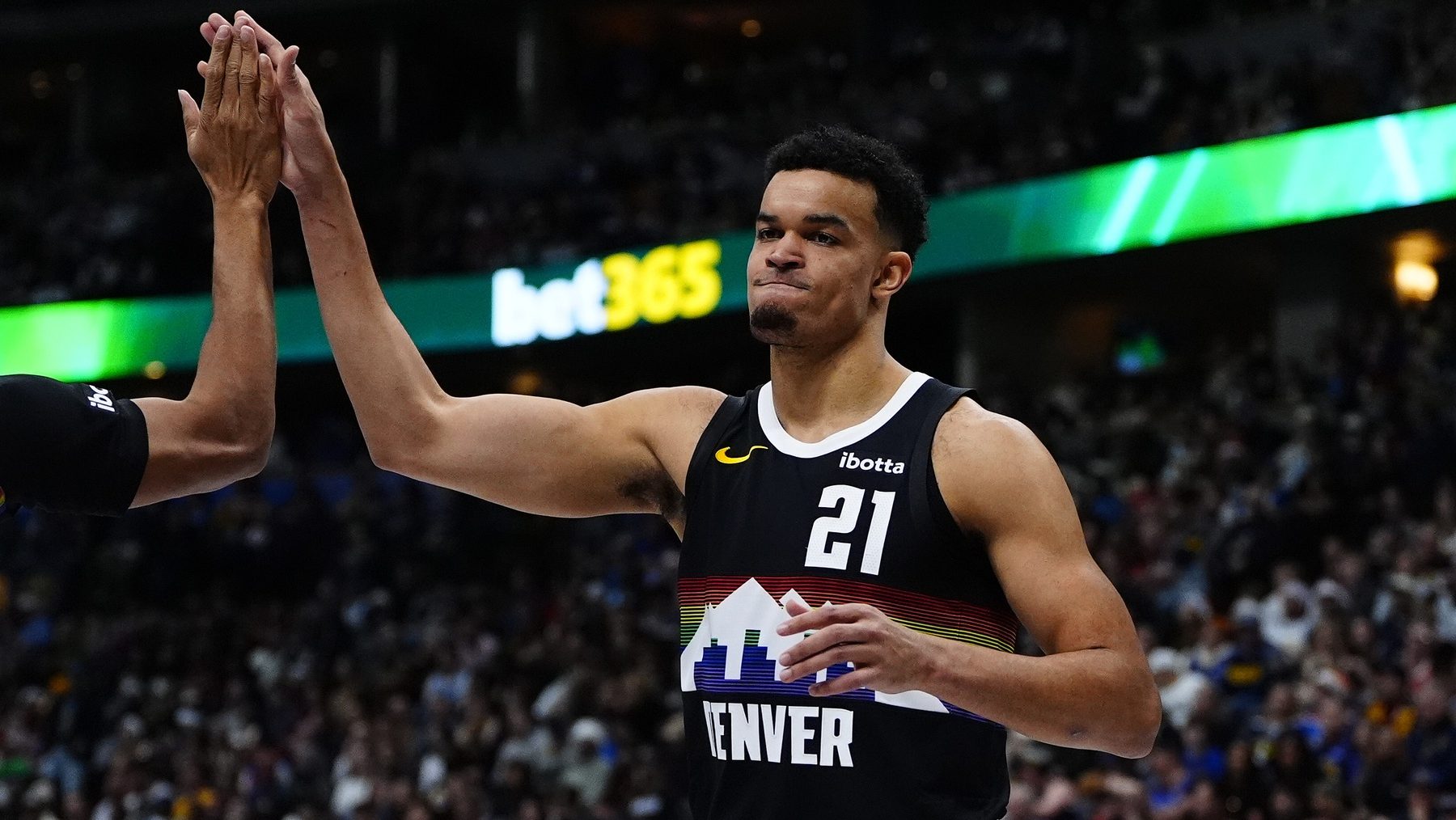 Dec 25, 2025; Denver, Colorado, USA; Denver Nuggets forward Spencer Jones (21) reacts against the Minnesota Timberwolves during the second half at Ball Arena