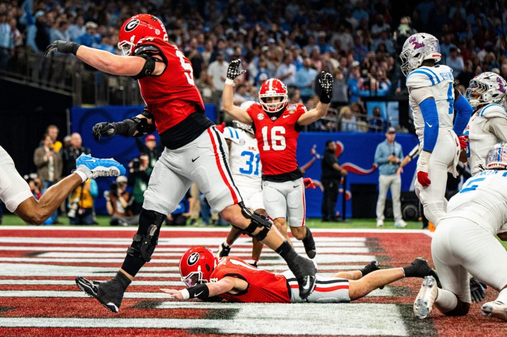 Georgia quarterback Gunner Stockton (14) celebrates after scoring a touchdown during the Sugar Bowl and College Football Playoff quarterfinals at Caesars Superdome in New Orleans, La., on Thursday, Jan. 1, 2026. Ole Miss defeated Georgia 39-34.