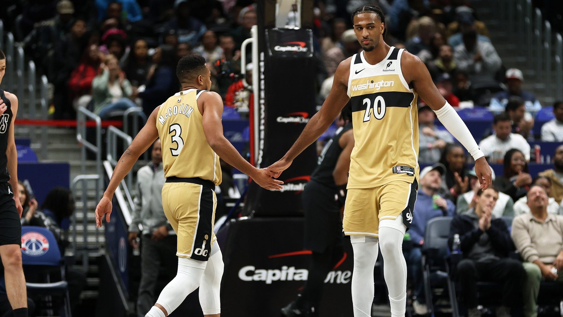 Jan 2, 2026; Washington, District of Columbia, USA; Washington Wizards center Alex Sarr (20) and Washington Wizards guard CJ McCollum (3) celebrate during the first half against the Brooklyn Nets at Capital One Arena.