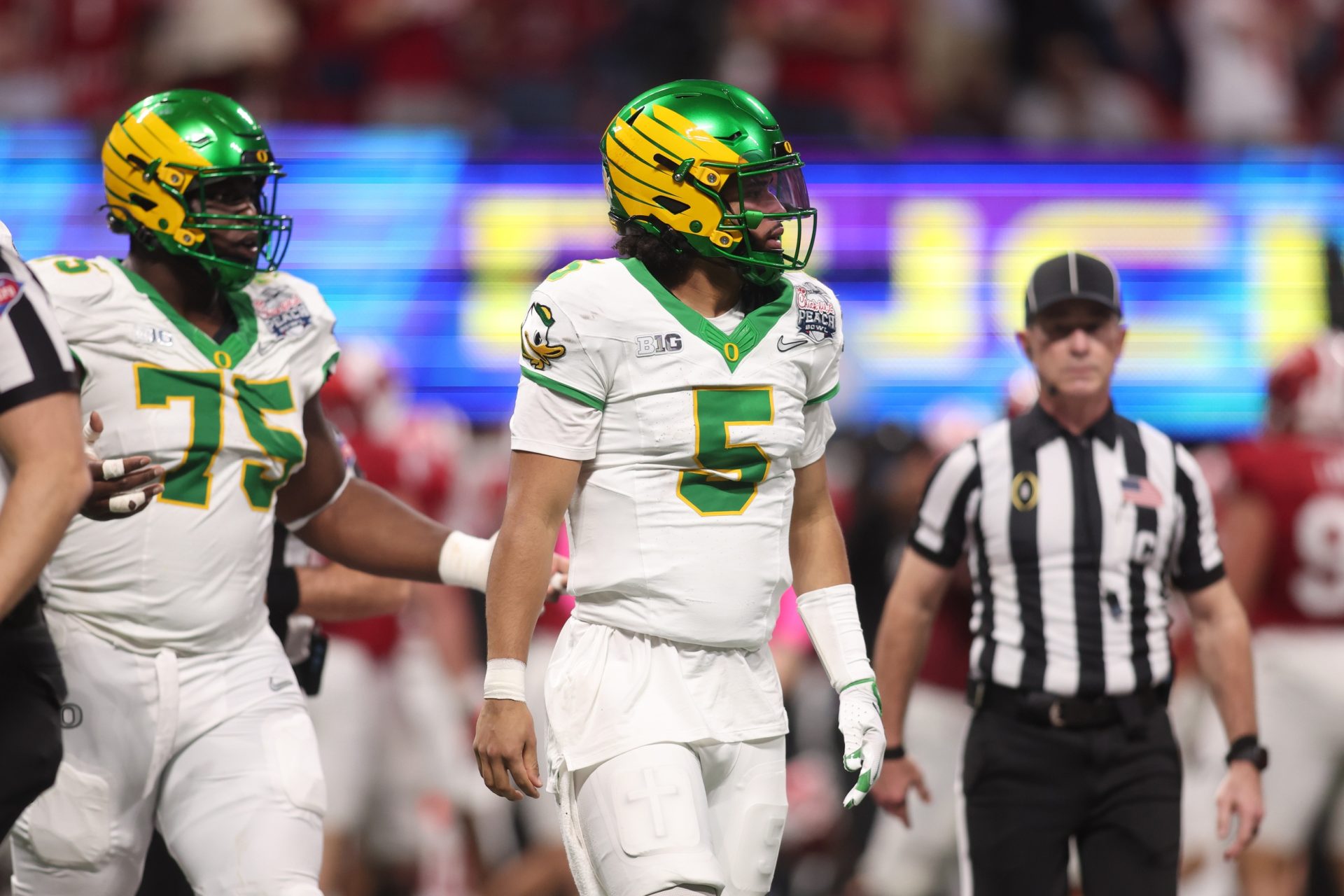 Jan 9, 2026; Atlanta, GA, USA; Oregon Ducks quarterback Dante Moore (5) reacts after a fumble against the Indiana Hoosiers during the first half of the 2025 Peach Bowl and semifinal game of the College Football Playoff at Mercedes-Benz Stadium.