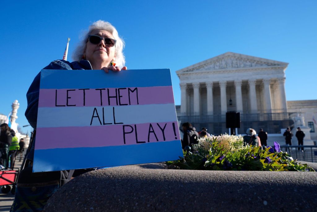 Demonstrators rally outside of the Supreme Court as the justices hear oral arguments in two cases related to transgender athlete participation in sports in Washington, DC, on Jan. 13, 2026. The cases, Little v. Hecox and West Virginia v. B.P.J., seek to decide whether laws that limit participation to women and girls based on sex violate the equal protection clause of the 14th Amendment.
