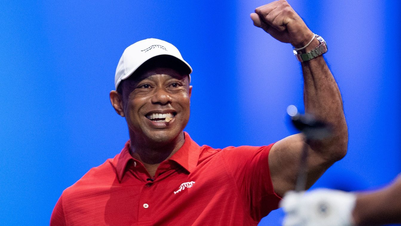 Tiger Woods of Jupiter Links cheers on a teammate during a TGL match against New York Golf Club at SoFi Center on January 13, 2026, in Palm Beach Gardens, Florida.